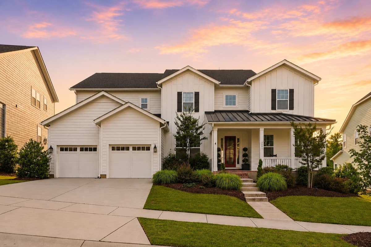 Front exterior of a new-construction home at twilight